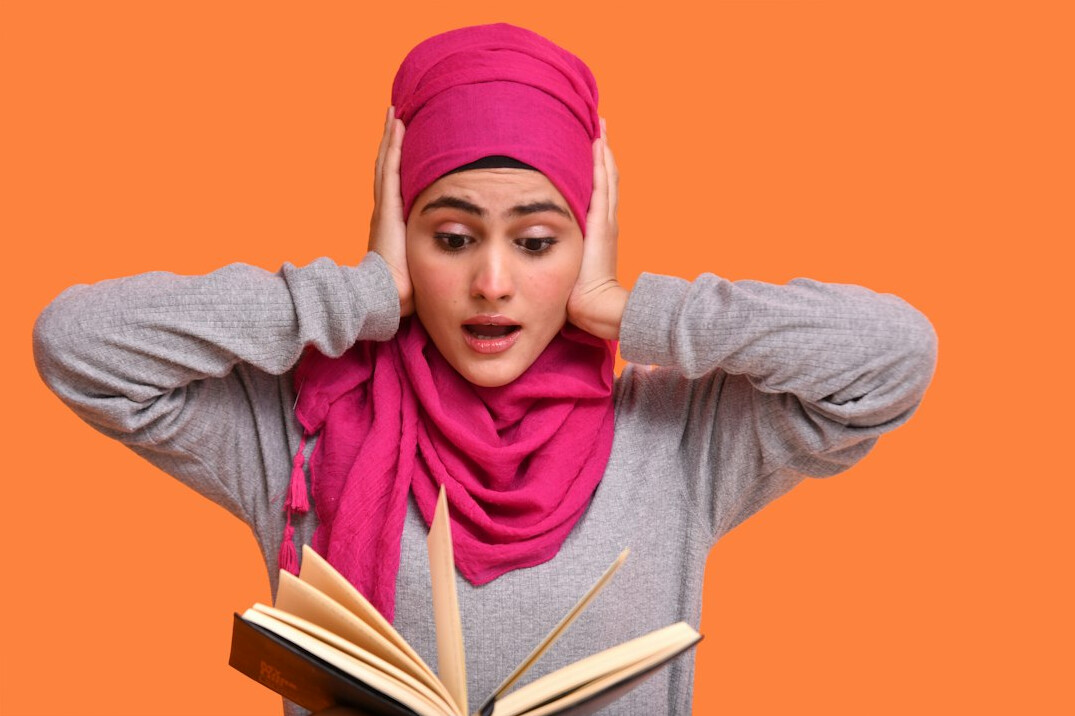 surprised person reading book